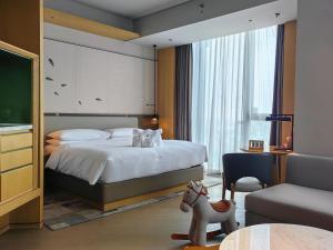 Cama ou camas em um quarto em Liyang Marriott Hotel