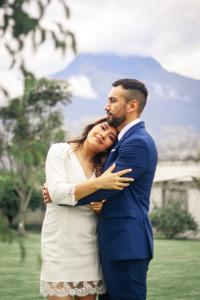 a man and a woman hugging each other at Finca San Alejandro in Cotacachi