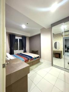 Ένα ή περισσότερα κρεβάτια σε δωμάτιο στο Thamrin City Serviced Condominium Full Facilities B2CT3A