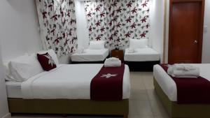 Letto o letti in una camera di Alec's Hotel