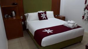 Letto o letti in una camera di Alec's Hotel