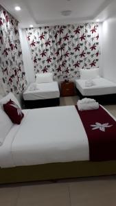 Letto o letti in una camera di Alec's Hotel