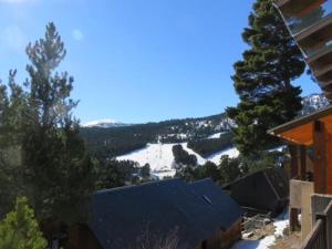 a view of a snow covered mountain from a house at Chalet Puyvalador station vue panoramique montagne in Puyvalador