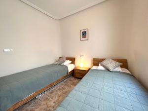 Posteľ alebo postele v izbe v ubytovaní Marina Sol - CABO ROIG