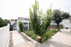 Zahrada ubytování Creek Tang B&B + 4 fotografie
