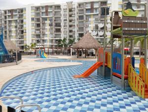 a playground at a resort with a slide at Apartamento en Peña Azul "La Aldea" Ricaurte, Cundinamarca in Ricaurte