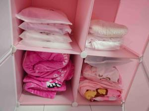 a pink drawer filled with pink and white towels at TT3 Soho@Tabuan Tranquility near Unimas,Tunku Putra in Kuching
