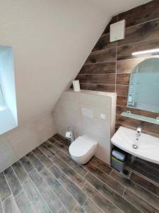 a bathroom with a toilet and a sink at Farmhouse Soklic in Bohinj