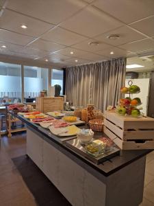 a buffet line with many plates of food on it at Hotell City in Härnösand