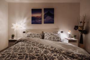 A bed or beds in a room at Case vacanze in graziosa borgata alpina