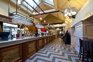 a bar in a restaurant with a checkered floor at The Red Lion Wetherspoon in Doncaster