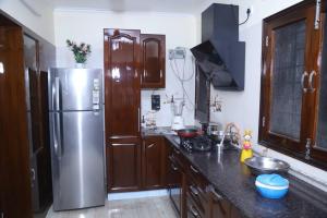 A kitchen or kitchenette at Fortune Home Service Apartment 3Bhk,B-57 Sarita Vihar