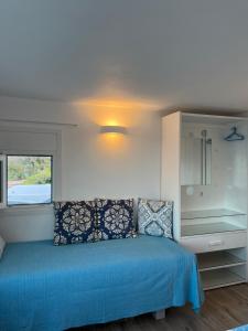 A bed or beds in a room at Seafront Villa Polyxene