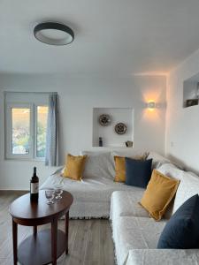 A seating area at Seafront Villa Polyxene