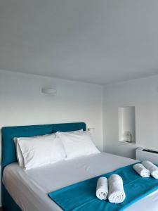 A bed or beds in a room at Seafront Villa Polyxene