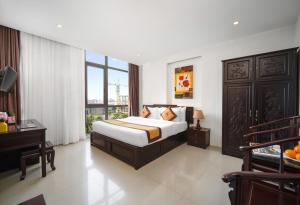 Voodi või voodid majutusasutuse Hoa Phong Airport Danang Hotel toas