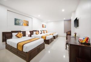 Voodi või voodid majutusasutuse Hoa Phong Airport Danang Hotel toas