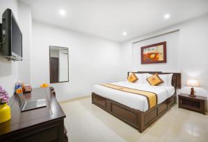 Voodi või voodid majutusasutuse Hoa Phong Airport Danang Hotel toas