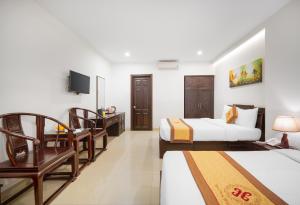 Voodi või voodid majutusasutuse Hoa Phong Airport Danang Hotel toas