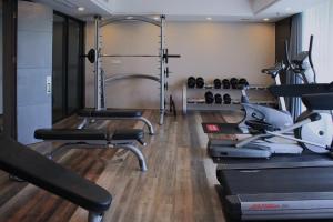 a gym with several treadmills and a treadmill at Amyitis Sky Garden - Located in the heart of Wulin with a view of Hangzhou West Lake in Hangzhou