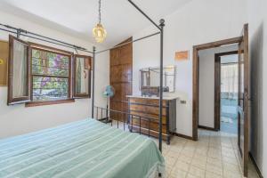 a bedroom with a bed and a dresser at casa Camilla in Torre delle Stelle