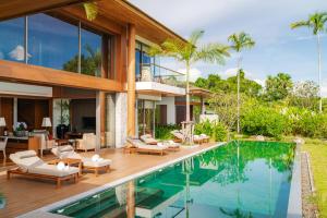 an image of a house with a swimming pool at Aquella Lakeside Villas in Thai Muang