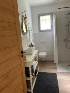 a bathroom with a toilet and a sink and a mirror at Le nid du vallon in Pomport +45 photos