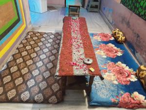 a long table with a table cloth on it at HOSTEL MONALISA PUSHKAR in Pushkar