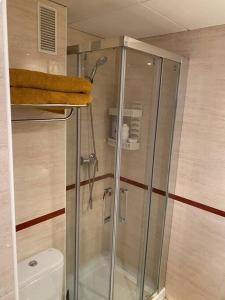 a shower stall in a bathroom with a toilet at Costa del Golf in Torre de Benagalbón