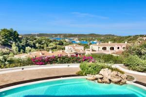 an image of a swimming pool at a resort at ISA-Residence wityh swimming-pool near Porto Cervo and only 350 meters from the beach in Liscia di Vacca