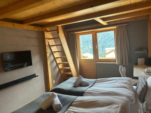 Postel nebo postele na pokoji v ubytování Pez Regina - Nordic Style Alps Hotel