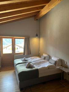 Postel nebo postele na pokoji v ubytování Pez Regina - Nordic Style Alps Hotel