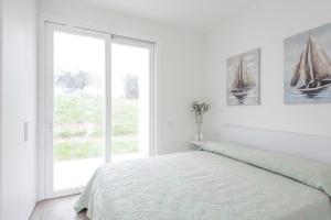 Ένα ή περισσότερα κρεβάτια σε δωμάτιο στο ISA-Residence with swimming-pool in Stintino near the famous La Pelosa-beach +18 φωτογραφίες