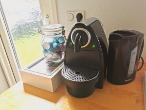 a coffee maker sitting on a counter next to a window at Boslodge 84 in Vorden