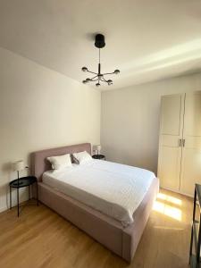 a bedroom with a bed and a ceiling fan at Zadar Relax Apartment in Zadar