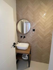 a bathroom with a sink and a mirror at Zadar Relax Apartment in Zadar