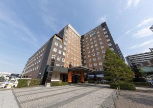 a large hotel building in a city at APA Hotel & Resort Tokyo Bay Shiomi in Tokyo +29 photos