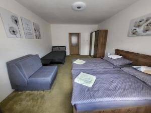 Postel nebo postele na pokoji v ubytování Apartmán DANY Hanušovice