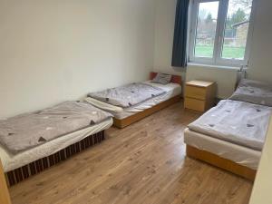 A bed or beds in a room at Sajó Vendégház
