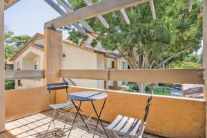 a pair of chairs and a table on a balcony at Mountain View 1BR w WD Pool Gym SFO-1068 in Mountain View