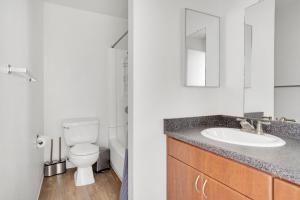 a bathroom with a sink and a toilet and a mirror at Mountain View 1BR w WD Pool Gym SFO-1068 in Mountain View +6 photos