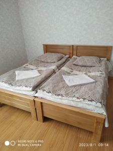 Llit o llits en una habitació de Guest House Besarioni
