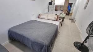 Ein Bett oder Betten in einem Zimmer der Unterkunft Playa de Las Canteras & Puerto Loft