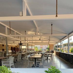 a dining area with tables and chairs in a restaurant at Doga Ciftlik Konaklama in Marmaris