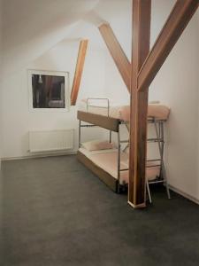 a bedroom with two bunk beds in a attic at Casa de sus in Braşov