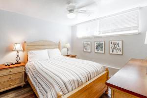 a bedroom with a bed and a window at 3009 Ocean Street- Unit C & D in Carlsbad