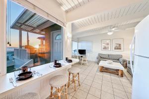 a kitchen and living room with a view of the ocean at Seascape Compound in Newport Beach