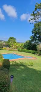 a view of two swimming pools in a yard at Bannockburn Guest Cottage in White River
