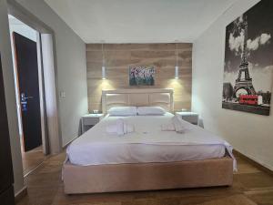 Postel nebo postele na pokoji v ubytování Hotel Pini