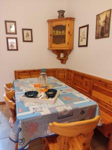 a dining room table with a table cloth on it at La Casa di Nino in Catania